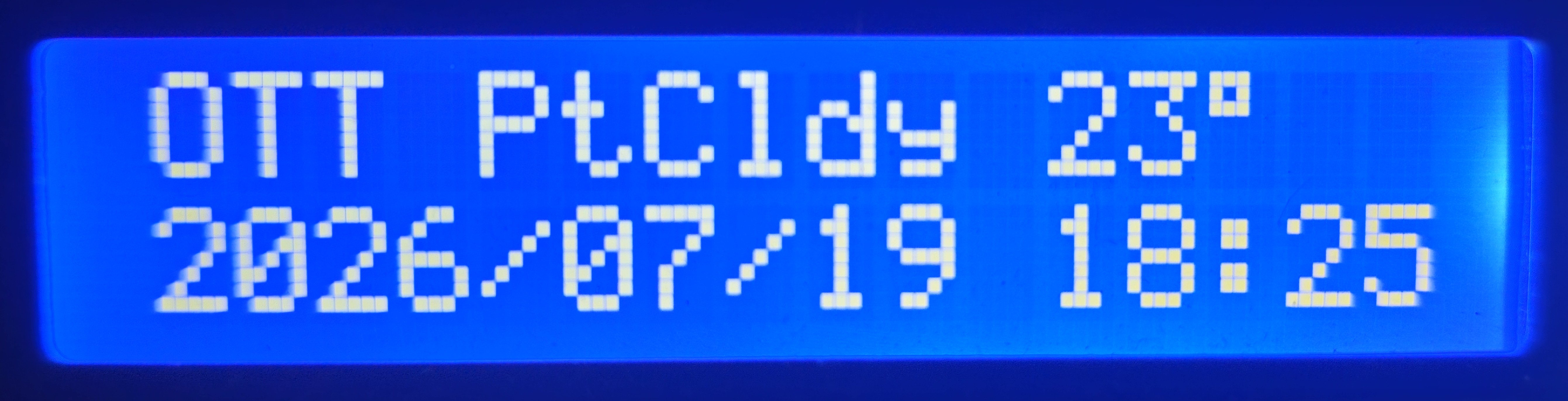 LCD clock view for Ottawa: partly cloudy, 23 degrees, with date and time